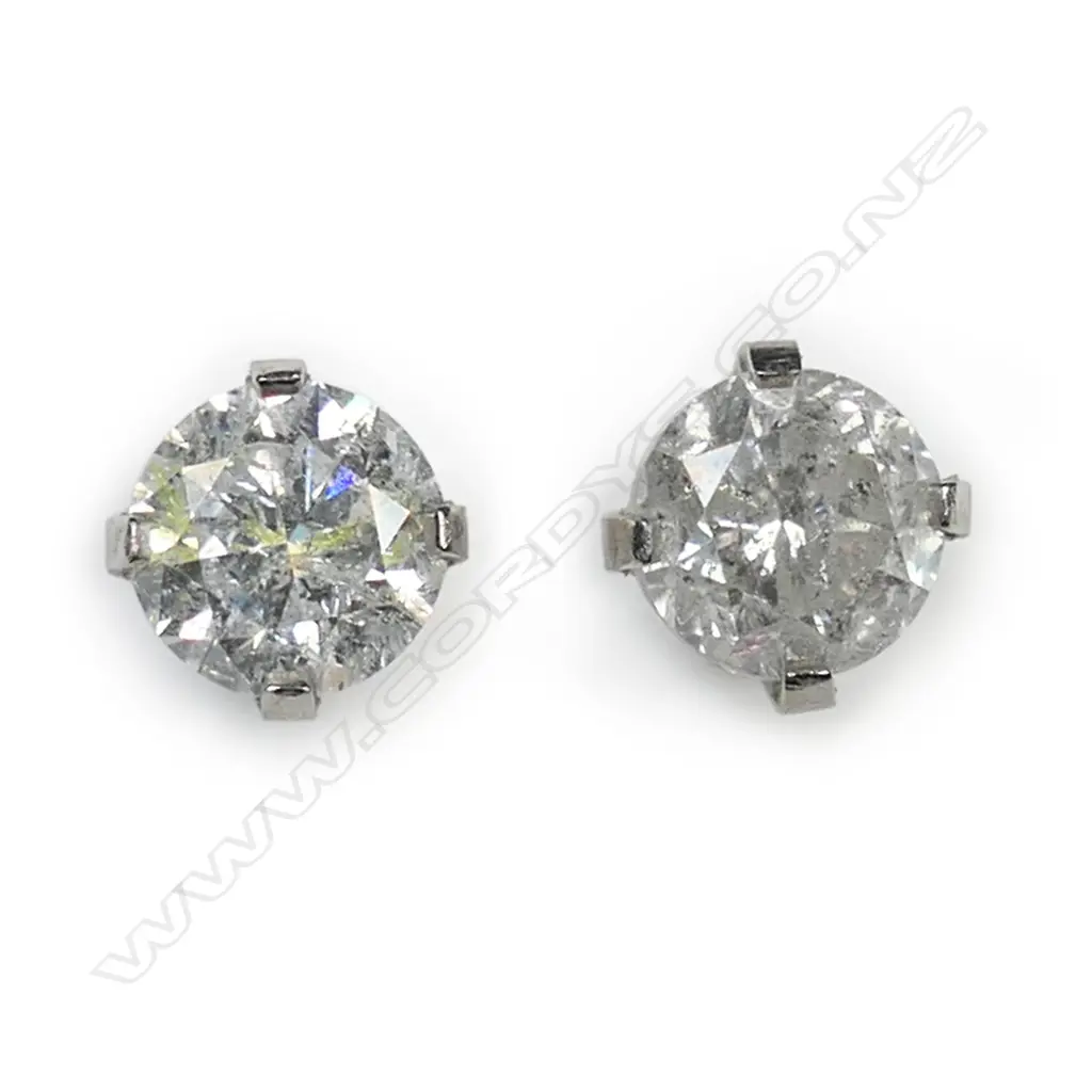 A pair of 14ct white gold and diamond stud earrings, Image 1++
