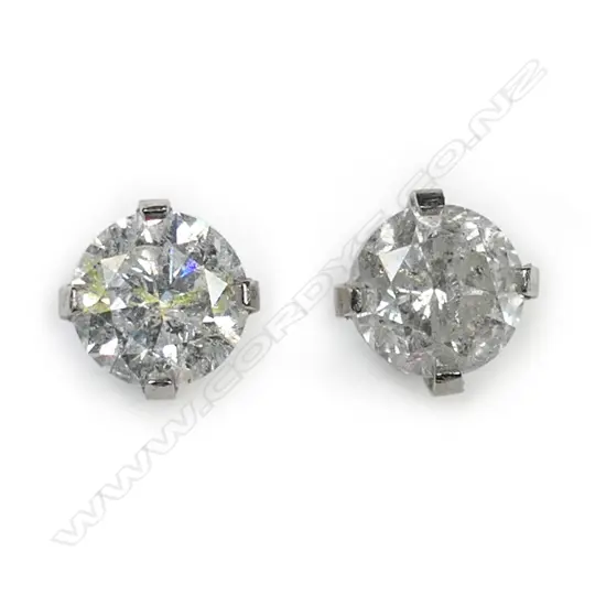 A pair of 14ct white gold and diamond stud earrings,