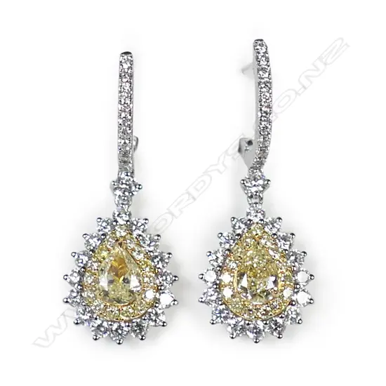A pair of 18ct yellow and white gold diamond earrings,