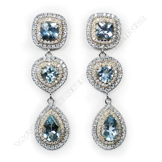 A pair of 14ct white and yellow gold aquamarine and diamond halo triple drop earrings,