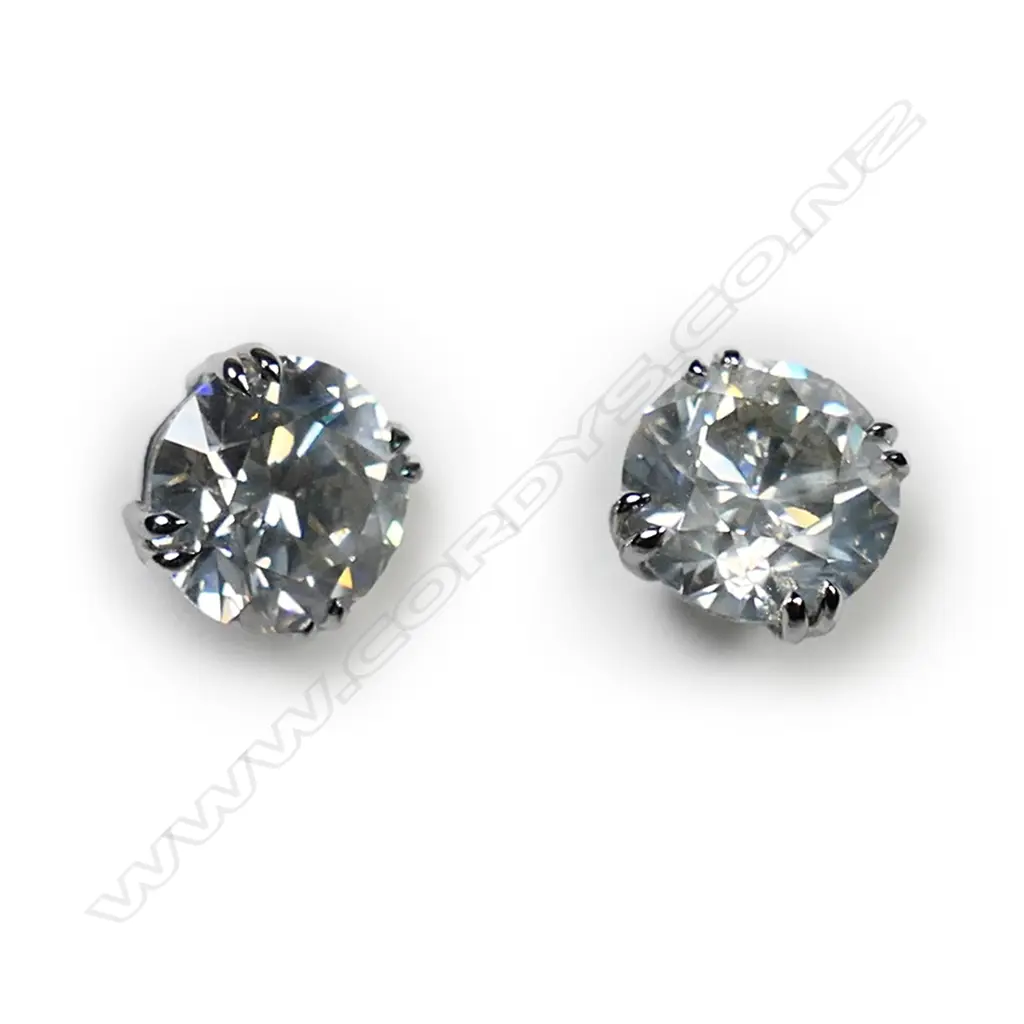 A pair of 18ct white gold and diamond stud earrings, Image 1++