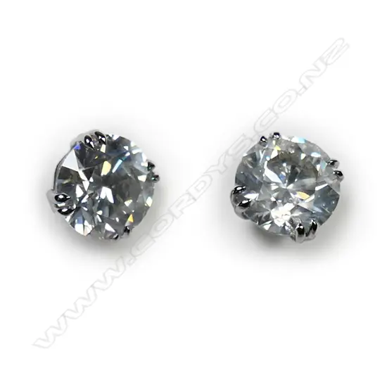A pair of 18ct white gold and diamond stud earrings,
