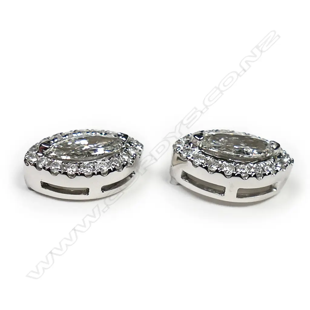 A pair of 14ct white gold and diamond halo stud earrings, Image 1++