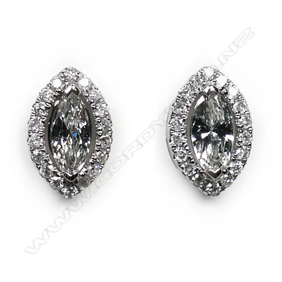 A pair of 14ct white gold and diamond halo stud earrings,