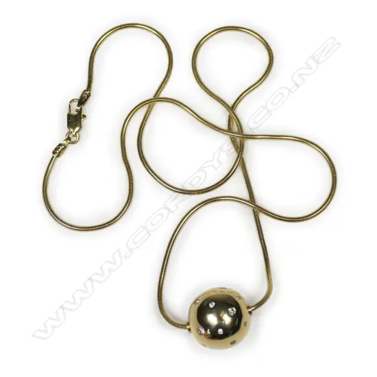 An 18ct yellow gold handmade diamond set ball on chain,