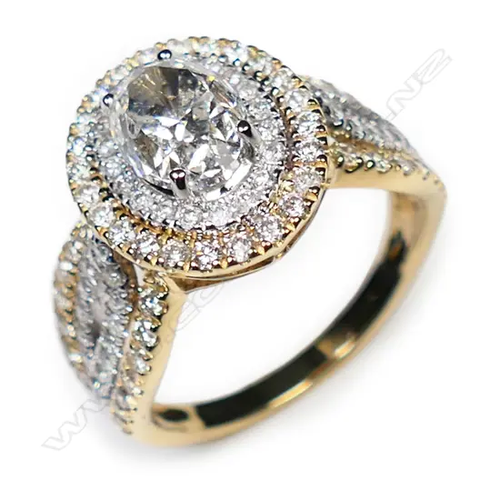 A 14ct yellow and white gold diamond double halo ring,