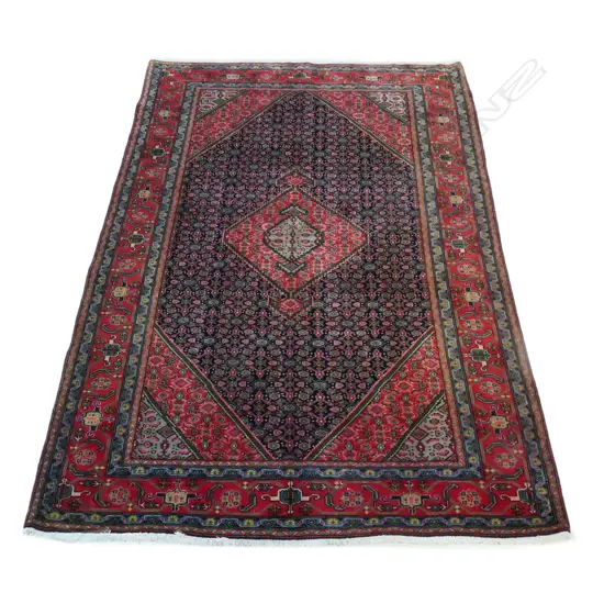 A hand-knotted wool pile Ardebil rug,