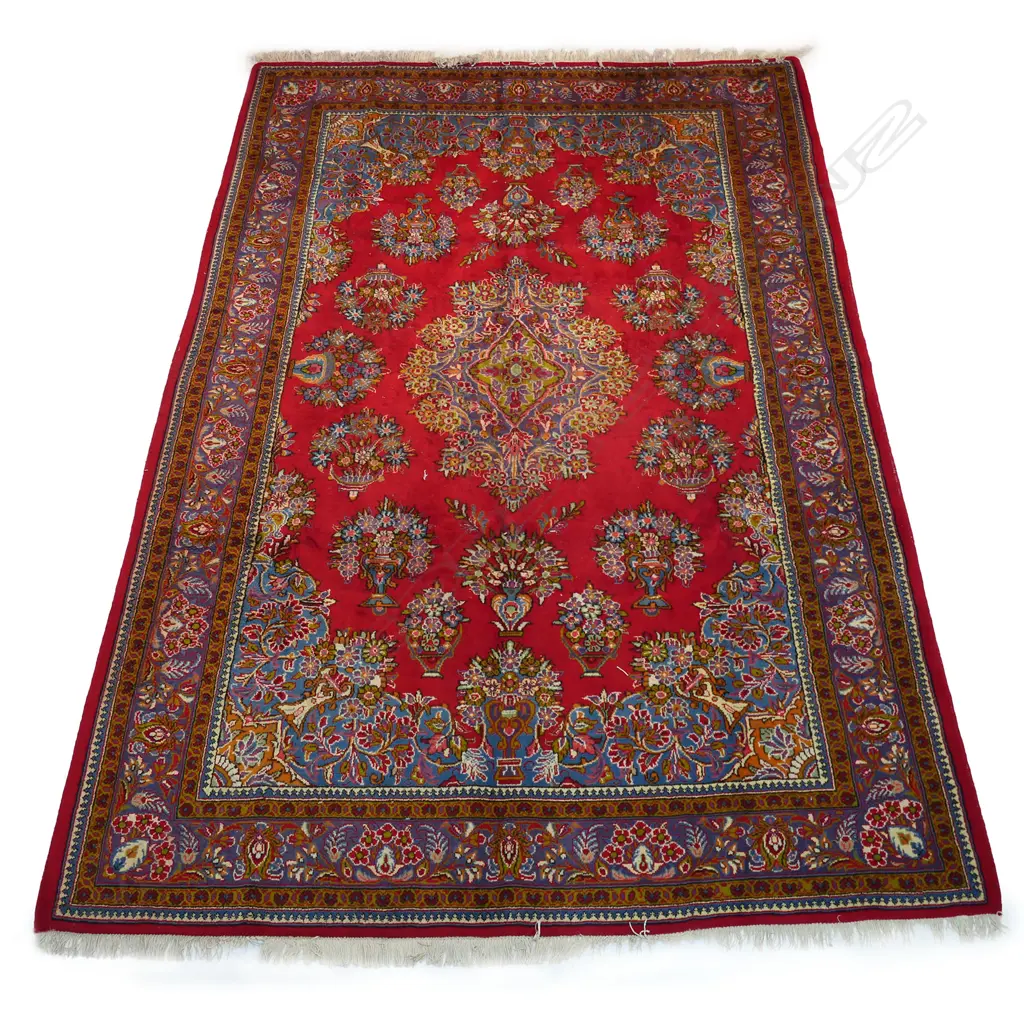 A large Golypayegan Isfahan carpet. The central field decorated with a large floral medallion surrounded by multiple floral basket motifs to the field and quadrants. Framed by traditional border guards. 3000 x 2000mm. Image 1++