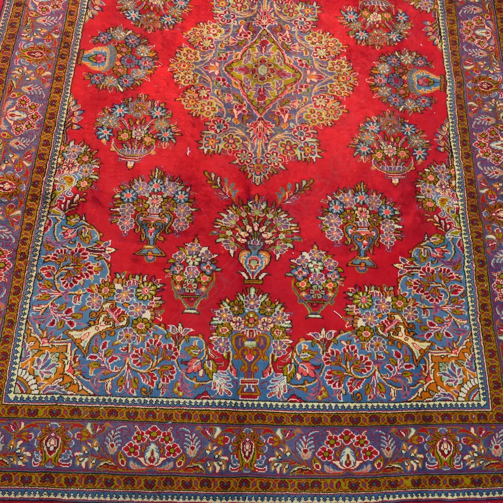 A large Golypayegan Isfahan carpet. The central field decorated with a large floral medallion surrounded by multiple floral basket motifs to the field and quadrants. Framed by traditional border guards. 3000 x 2000mm. Image 1++