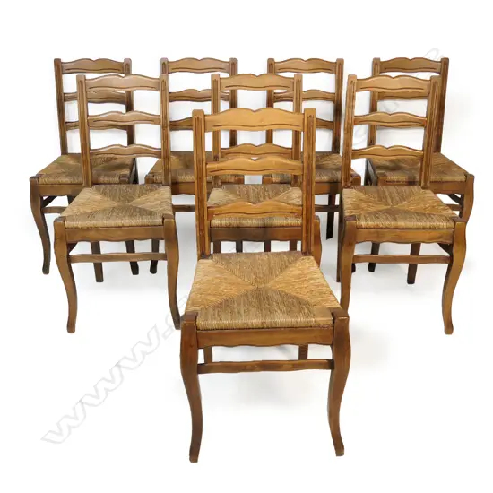 A set of eight 20thC French ladder back chairs,