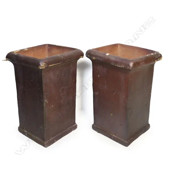 A pair of tall ironstone garden planters,