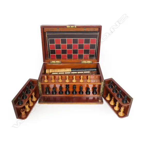A vintage mahogany games box,