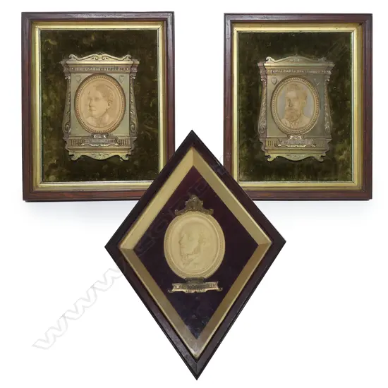 Three turn-of-the-century framed terracotta and brass memorial plaques,