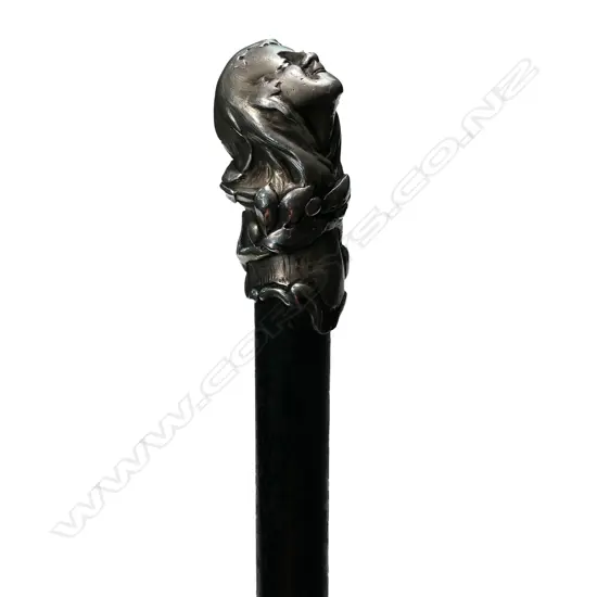 An early 1900s silver topped walking cane,