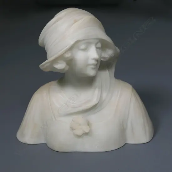 A late 19thC Art Nouveau white alabaster bust of a young maiden,