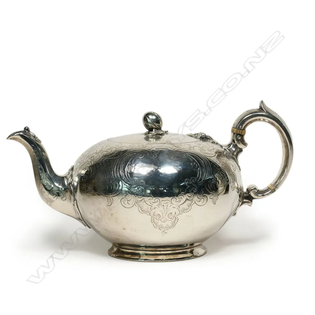 A Victorian silver compressed spherical teapot, Image 1++