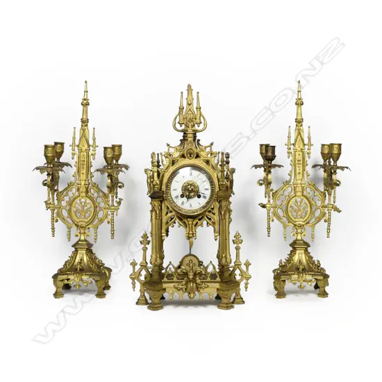A 19thC French three-piece gilt metal clock garniture set,