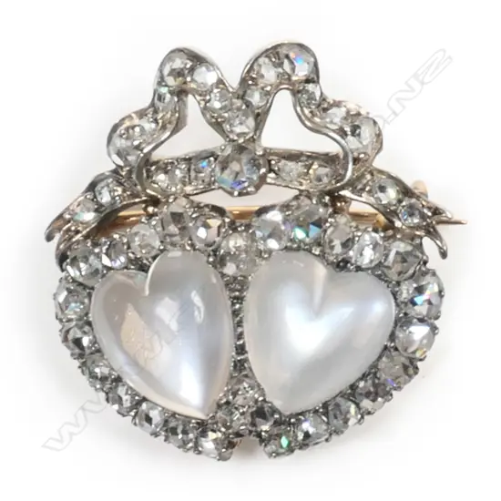 A Victorian 9ct gold and silver diamond and moonstone entwined heart brooch,