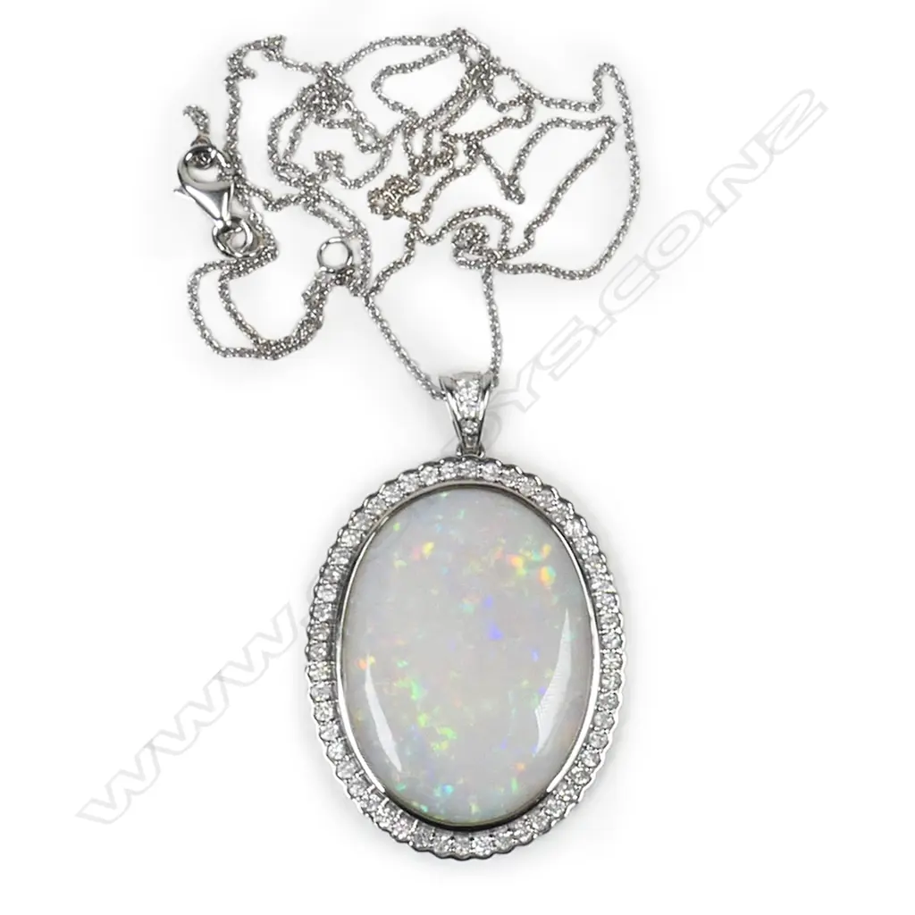 A 14ct white gold, opal and diamond pendant, Image 1++