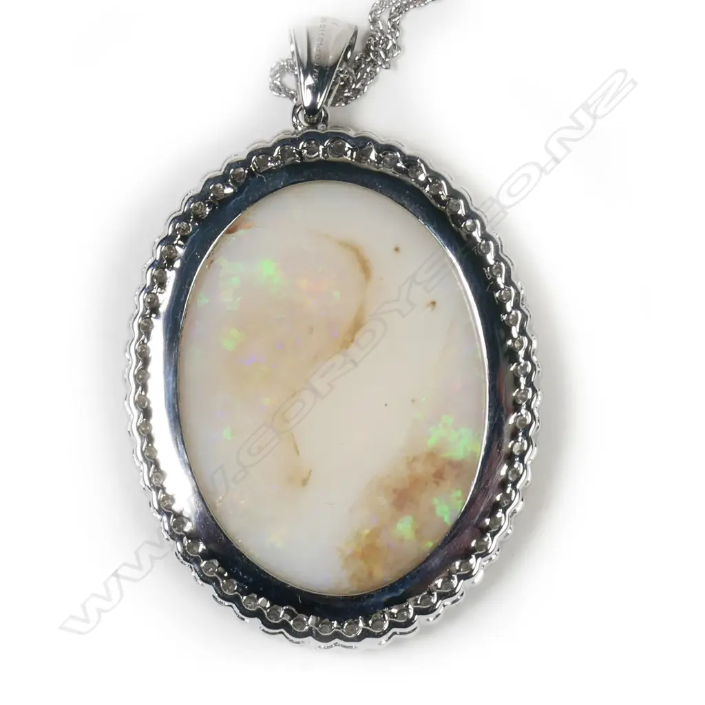 A 14ct white gold, opal and diamond pendant, Image 1++