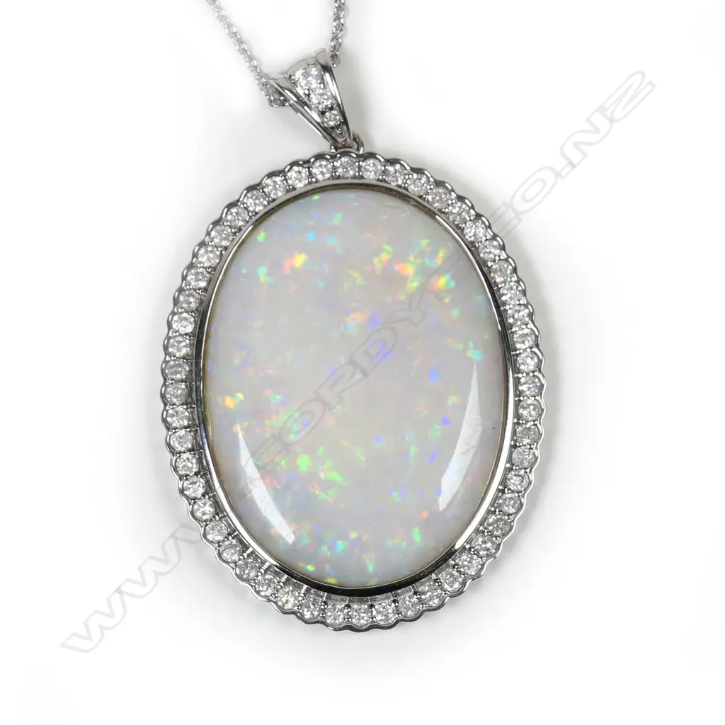 A 14ct white gold, opal and diamond pendant, Image 1++