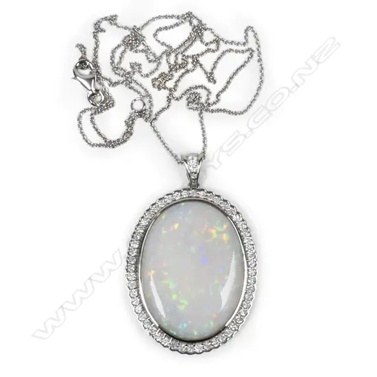 A 14ct white gold, opal and diamond pendant,