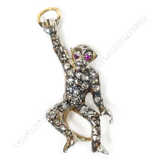 A silver gilt Old Mine cut diamond set hanging monkey pendant,