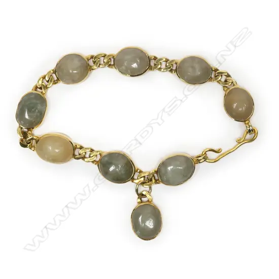 A 22ct gold and jade bracelet,
