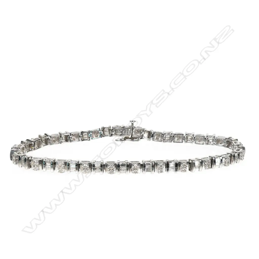 A 14ct white gold and diamond tennis bracelet, Image 1++
