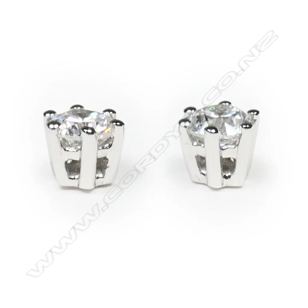 A pair of 18ct white gold and diamond stud earrings, Image 1++