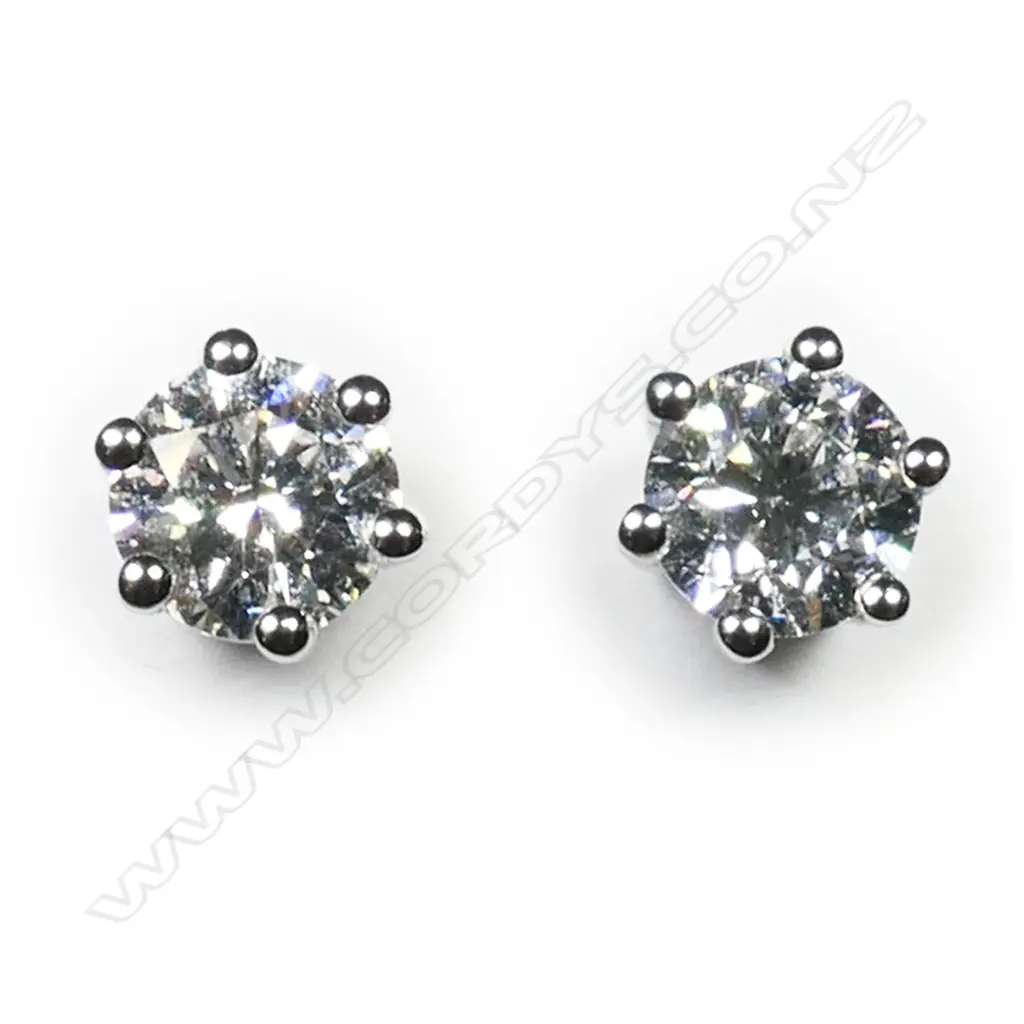 A pair of 18ct white gold and diamond stud earrings, Image 1++