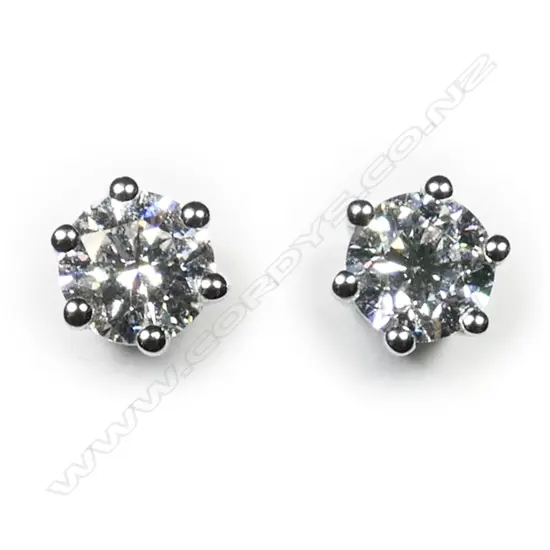 A pair of 18ct white gold and diamond stud earrings,