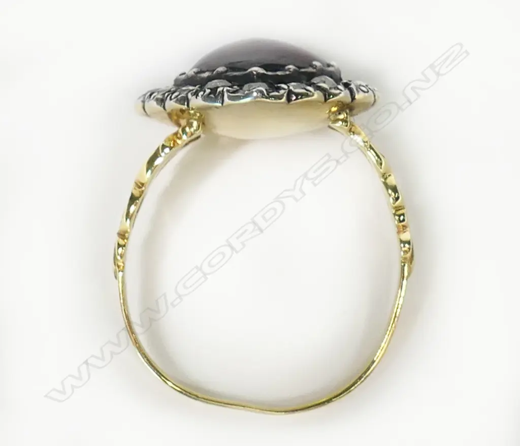 A 14ct yellow gold garnet and diamond ring, Image 1++