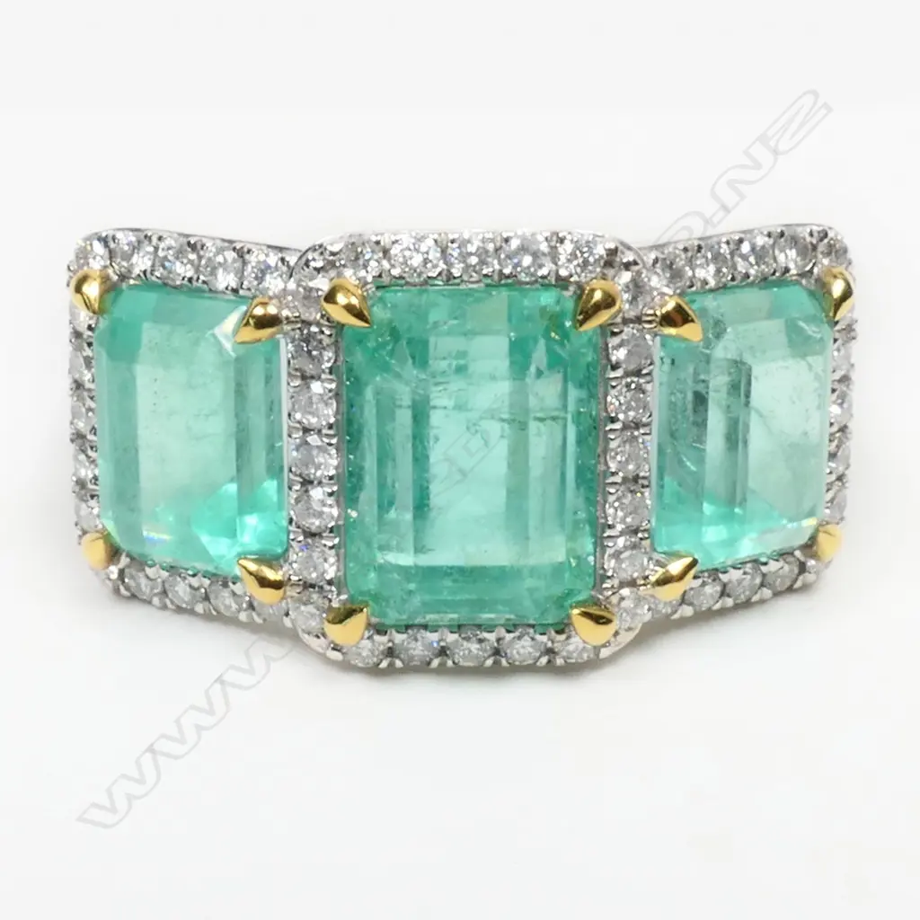 A 14ct white gold, diamond and Columbian emerald trilogy ring, Image 1++