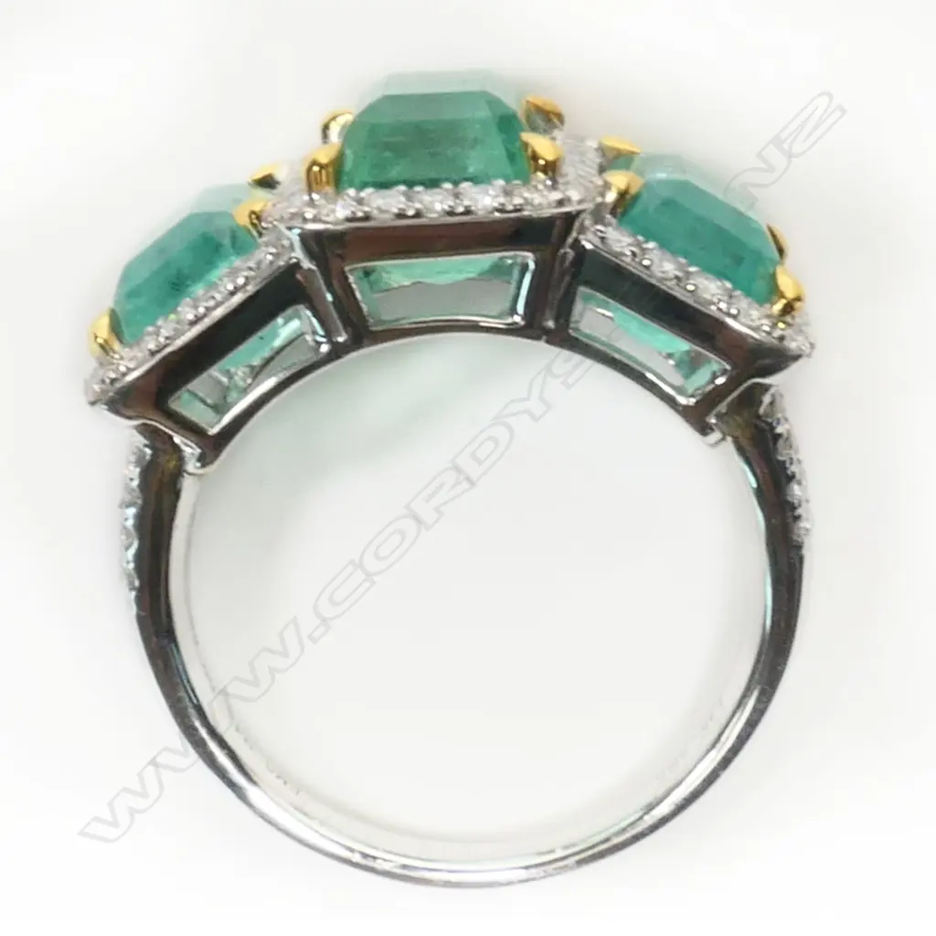 A 14ct white gold, diamond and Columbian emerald trilogy ring, Image 1++