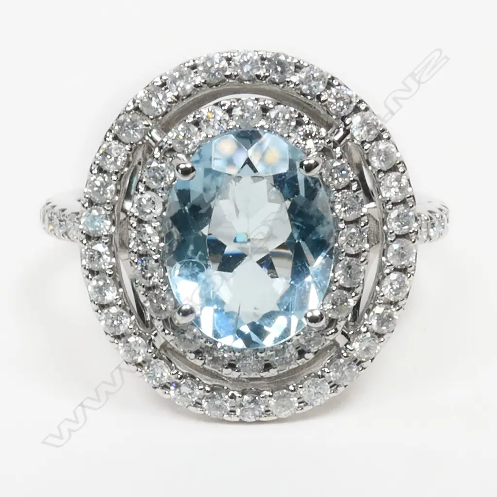 A 14ct white gold, aquamarine and diamond double halo ring, Image 1++