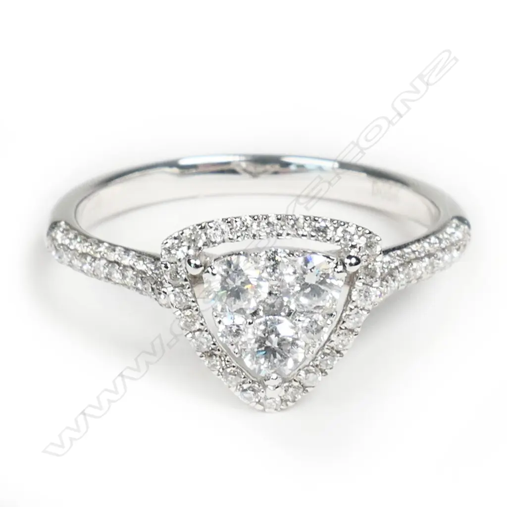 An 18ct white gold and diamond cluster ring, Image 1++