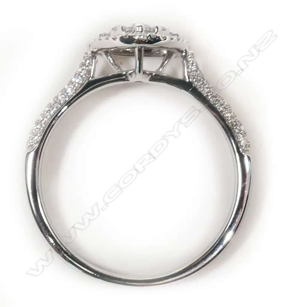An 18ct white gold and diamond cluster ring, Image 1++