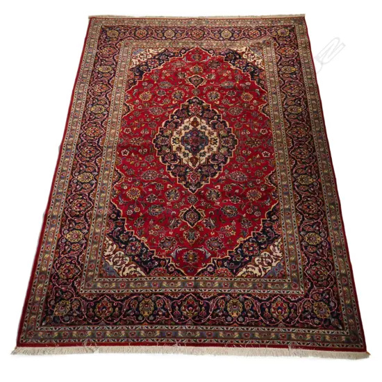 A hand-knotted Persian Kashan rug,