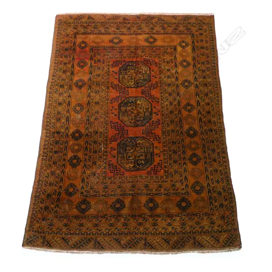 A hand-knotted elephant foot motif carpet