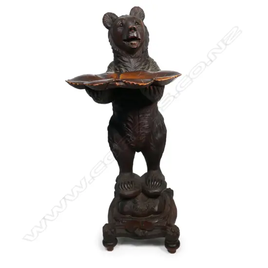 A rare late 19thC Black Forest standing bear card stand,