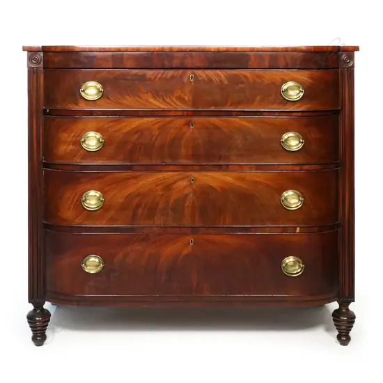 A Regency mahogany barrel fronted four drawer chest,