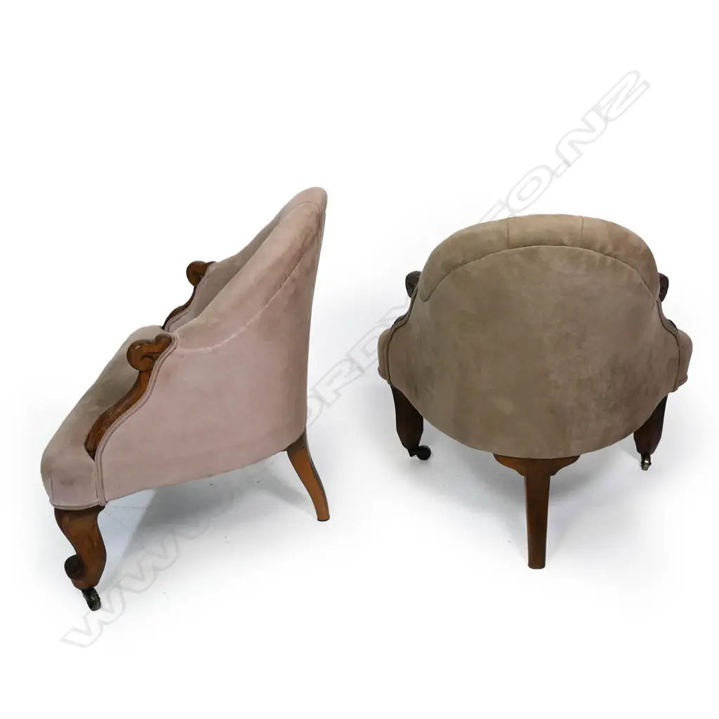 A pair of uncommon Victorian rosewood detailed corner chairs / the arched buttoned backs and sprung seats upholstered in tan suede / the carved rosewood scroll arms and feet with acanthus leaf detail. Original brass castors. 720 X 760mm. Image 1++