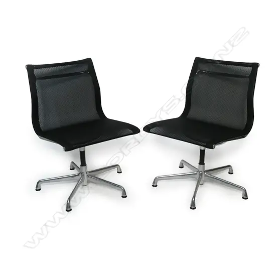 A pair of black Eames Herman Miller E330-5401 Management chairs,