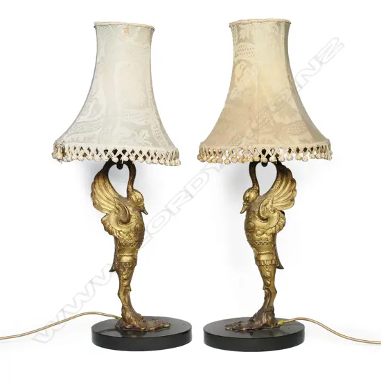A pair of 19thC gilt metal stylised swan table lamps,