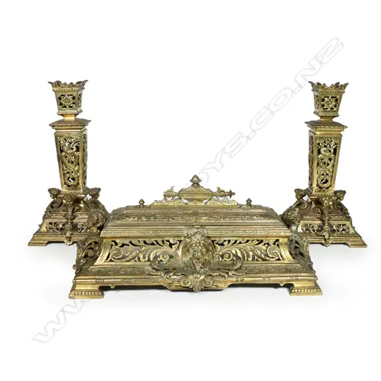 An ornate Victorian brass desk set,