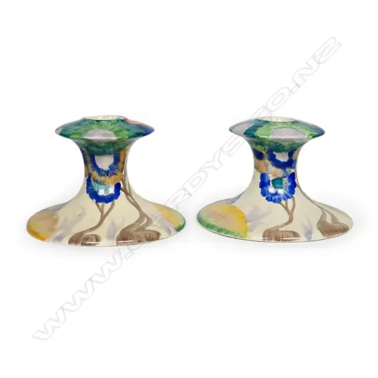 A pair of Clarice Cliff candlesticks,