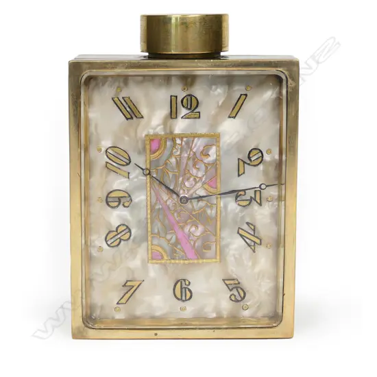 An Art Deco Juvenia perfume bottle travel clock,