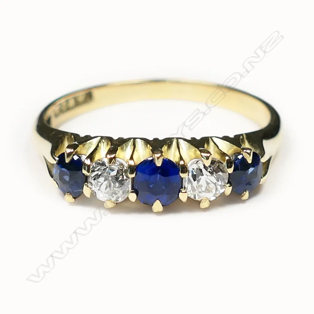 An estate 18ct sapphire and diamond five stone bridge ring, Image 1++