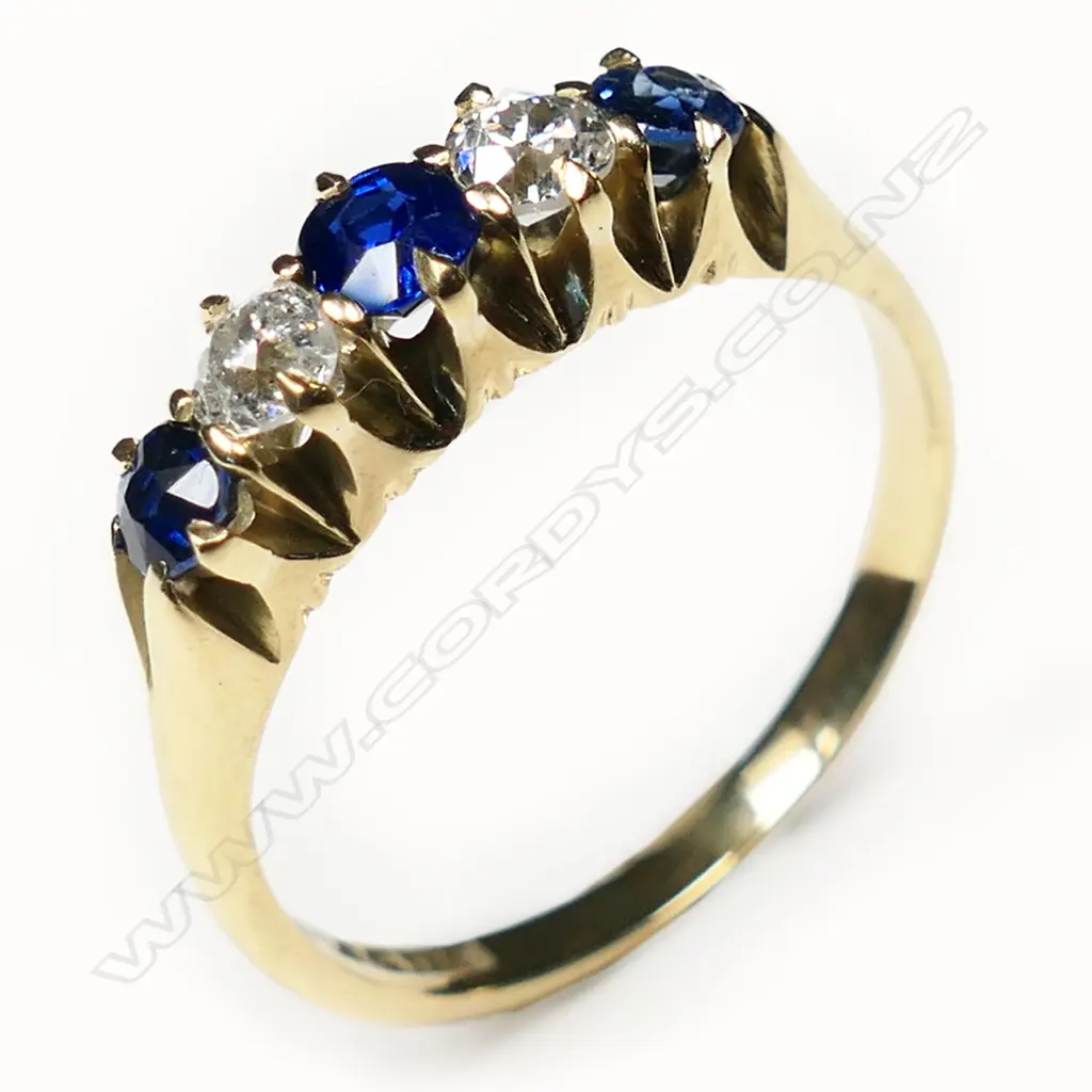 An estate 18ct sapphire and diamond five stone bridge ring, Image 1++